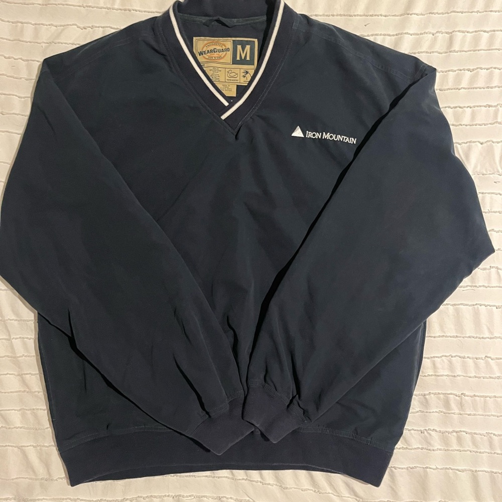 blue & white iron mountain logo windbreaker
